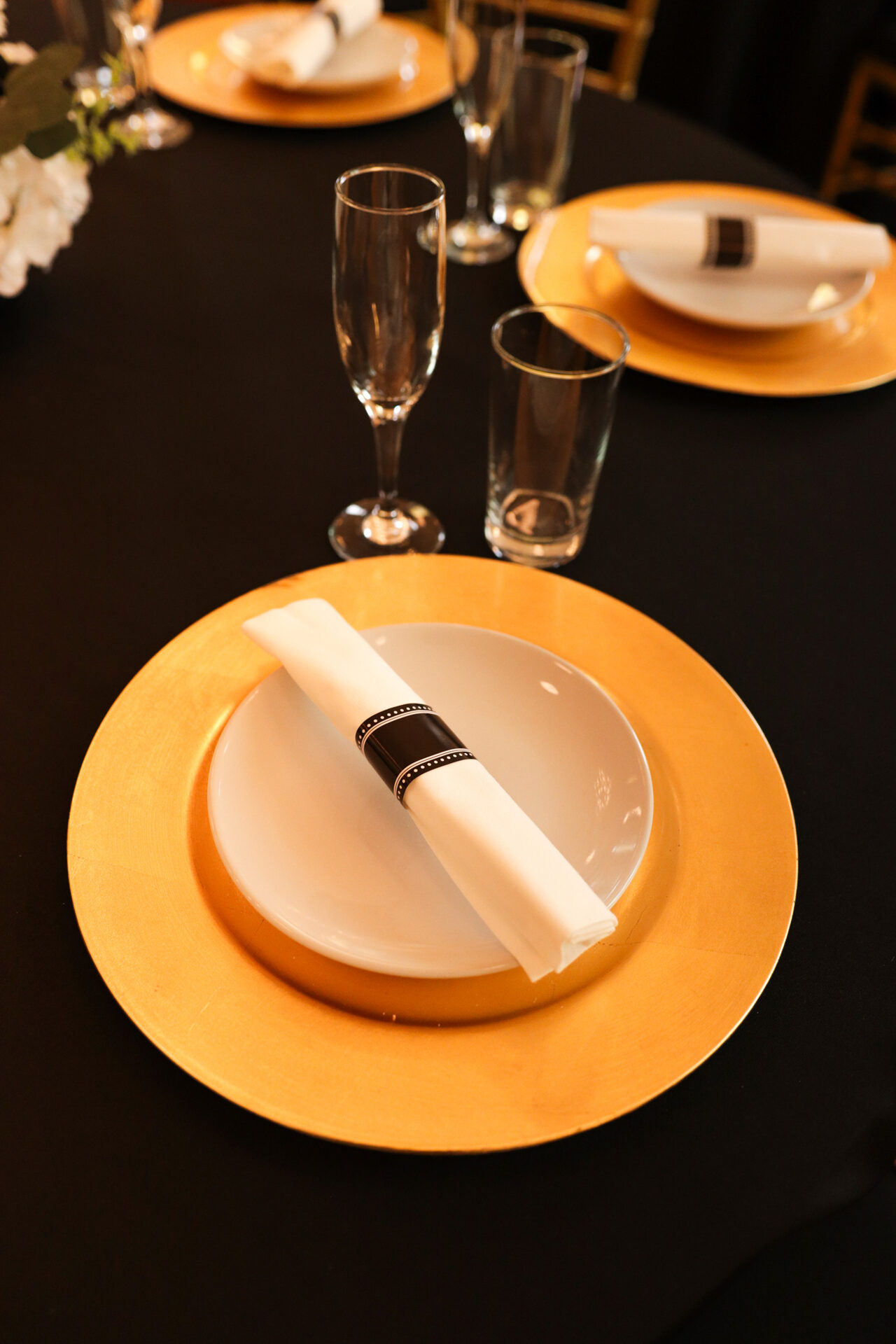 Elegant place setting with gold charger